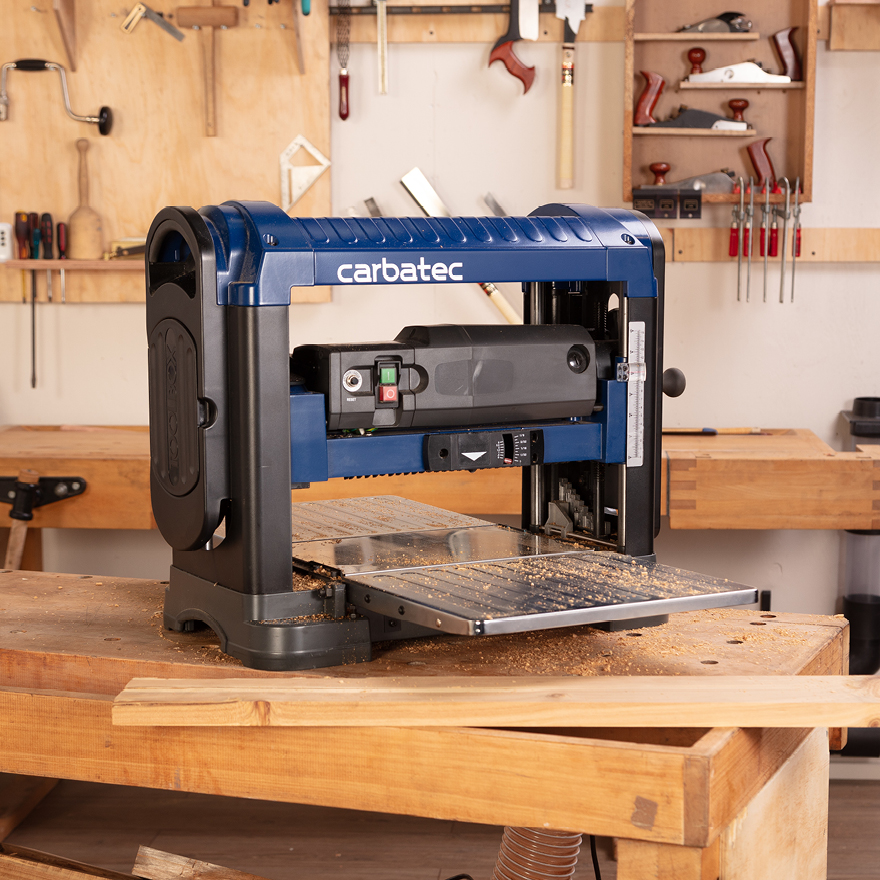 A compact woodworking workshop with benchtop machinery